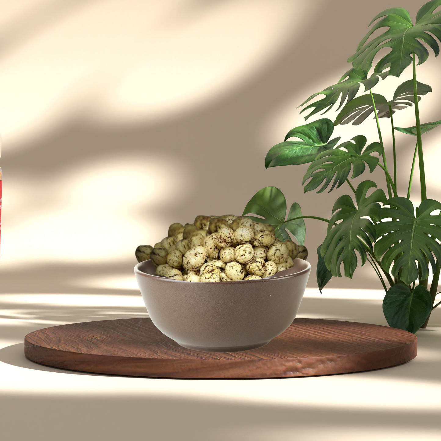 Bowl of Black Pepper Makhana placed on wooden board with green plants in the background