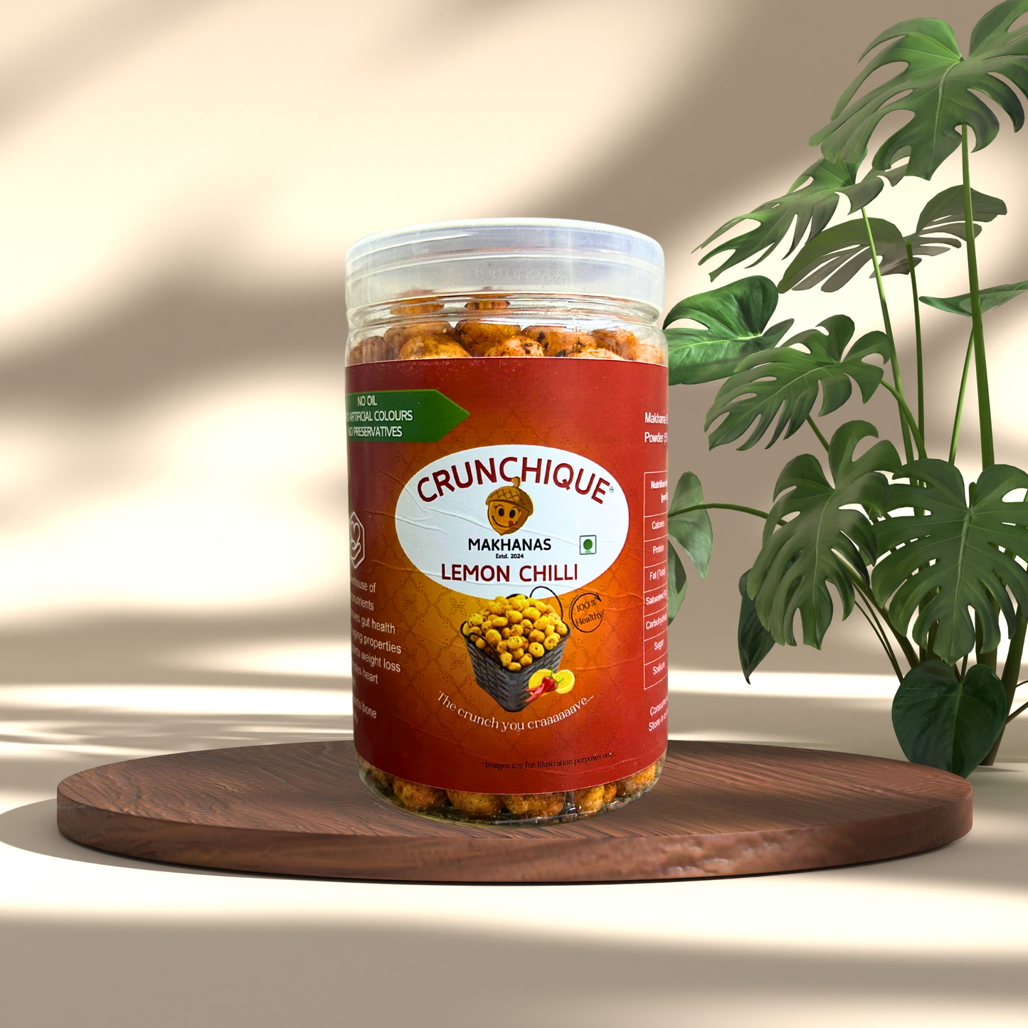 Crunchique Lemon Chilli Makhana - Tangy Spicy and Healthy snack in a clear plastic jar with red label on wooden board