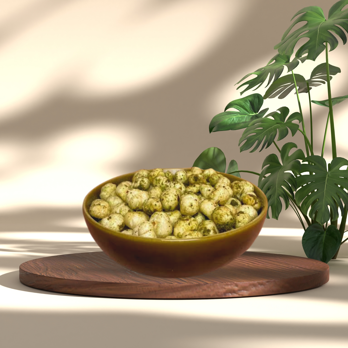 Bowl of crunchy Pudina Makhana seasoned with green herbs on a wooden board next to a green plant