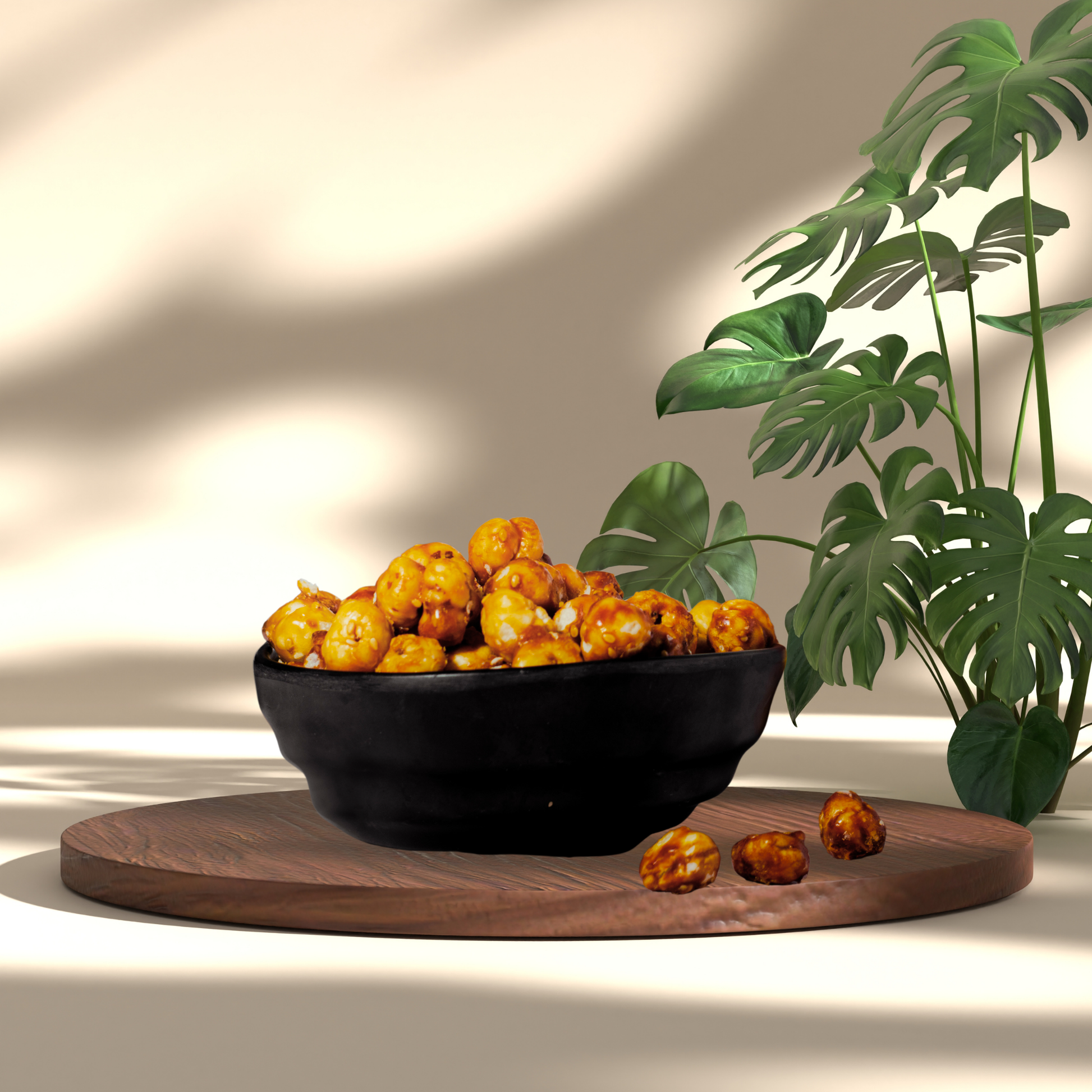 Gud Makhana Sweet Healthy Guilt-Free caramelized popcorn in black bowl on wooden board with green plant